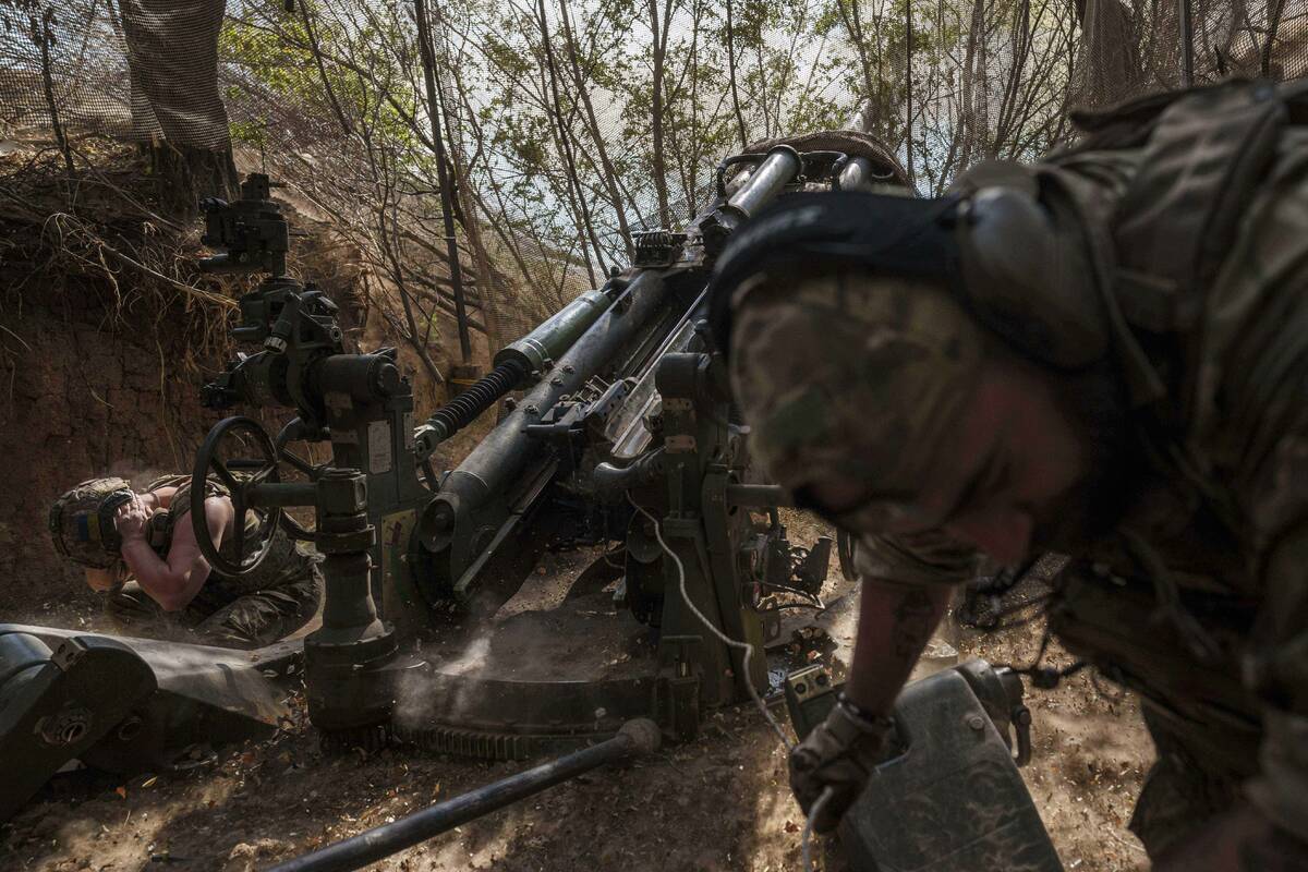 Ukrainian servicemen of the 148th artillery brigade fire from a M777 howitzer towards Russian p ...