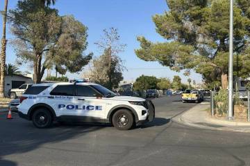 North Las Vegas police work the scene of a fatal shooting in the 3100 block of Emmons Avenue on ...
