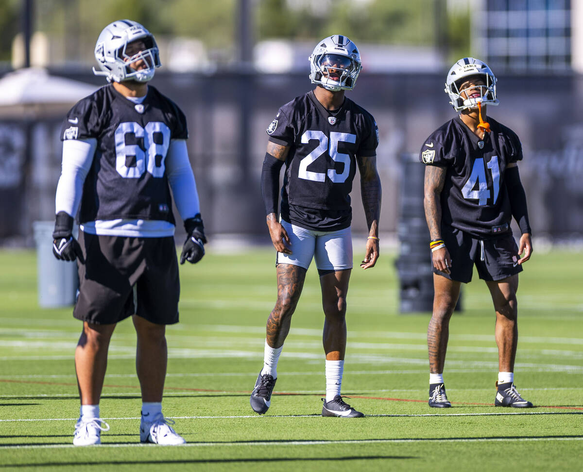 Raiders defensive tackle Treven Ma'ae (68), cornerback Decamerion Richardson (25) and cornerbac ...