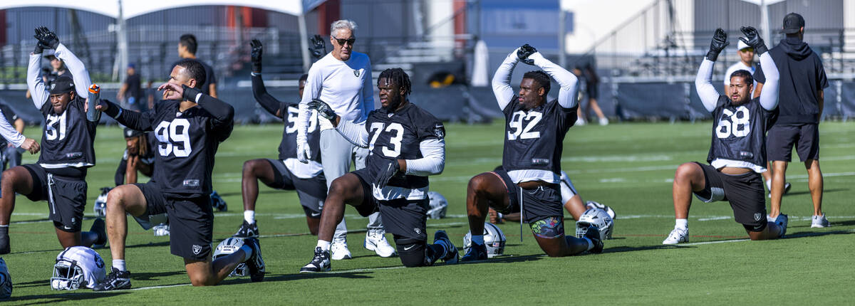 Raiders defensive end Andre Carter II (99), defensive tackle Tank Booker (73), defensive tackle ...