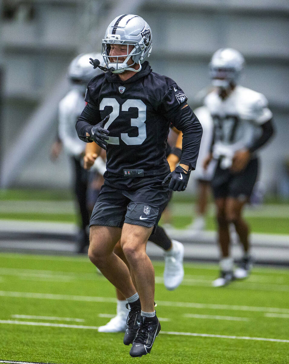 Raiders running back Dylan Laube (23) hops from foot to foot while warming up during training c ...
