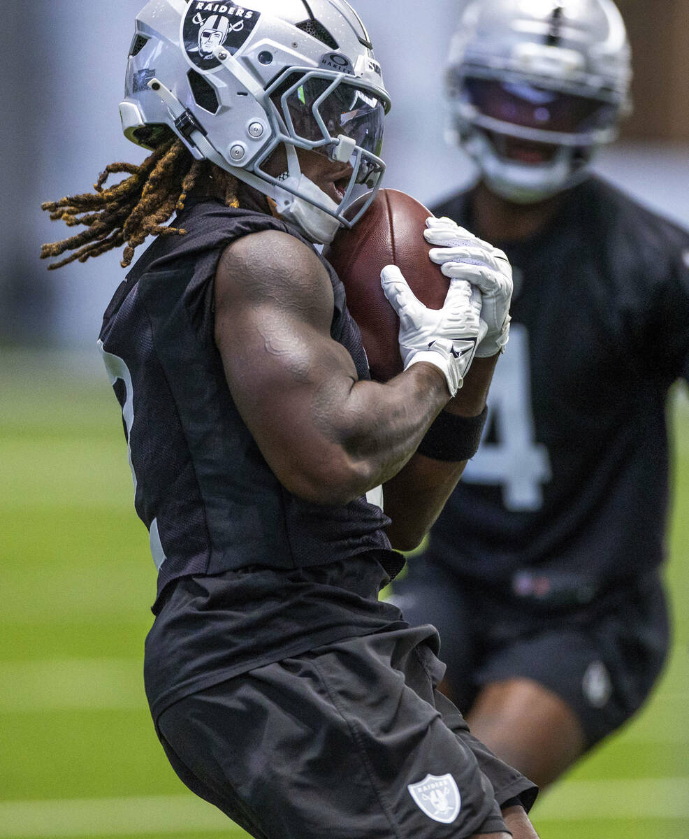 Raiders running back Ashton Jeanty (2) runs after a catch during training camp in the Intermoun ...