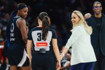 Aces head coach Becky Hammon looks back at a referee during a WNBA basketball game between the ...