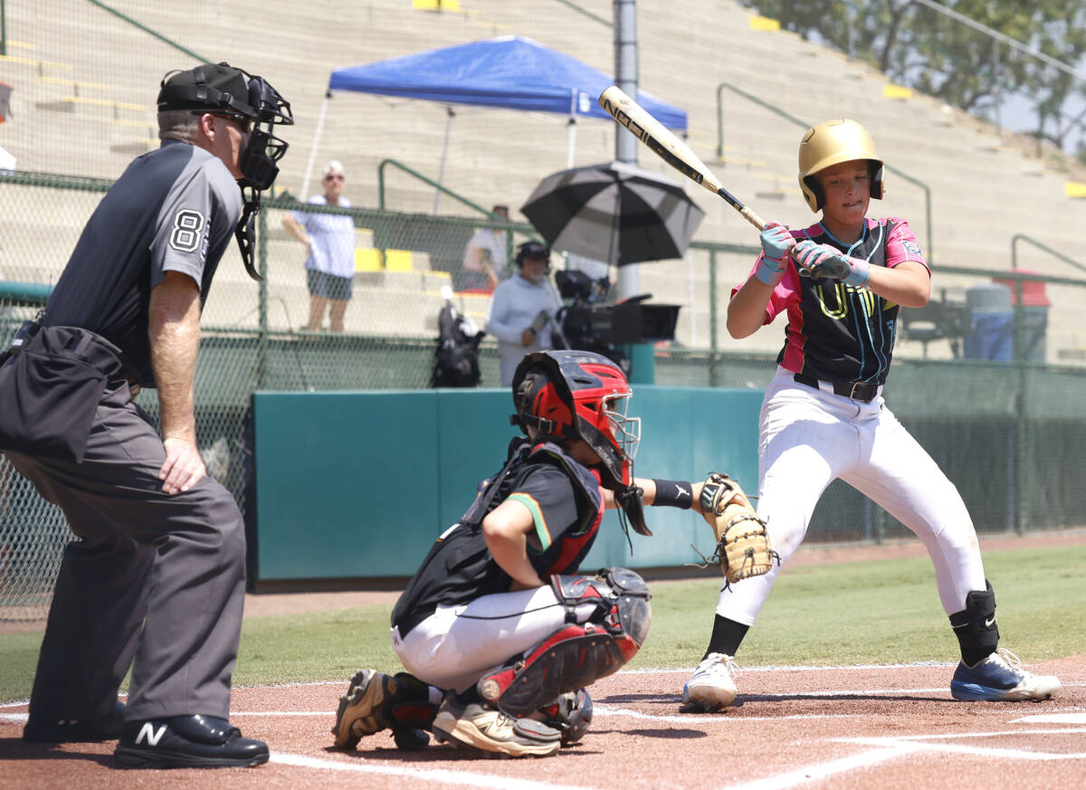 Nevada's catcher Dustin Greusel (2) catches a strike ball as Utah's Nolan Hughes (19) looks on ...