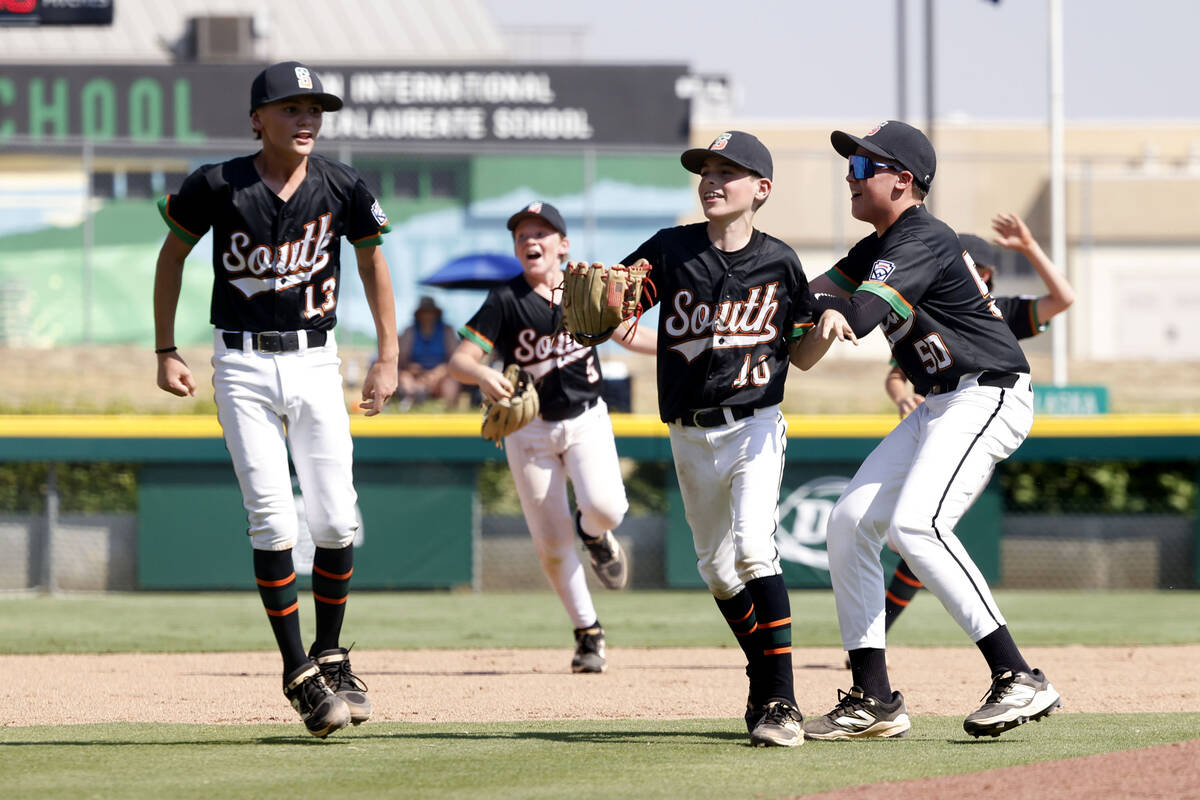 Nevada players celebrate their 6-3 win against Utah during the Mountain Regional final baseball ...