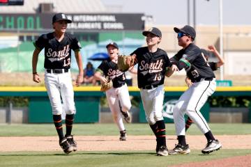 Nevada players celebrate their 6-3 win against Utah during the Mountain Regional final baseball ...