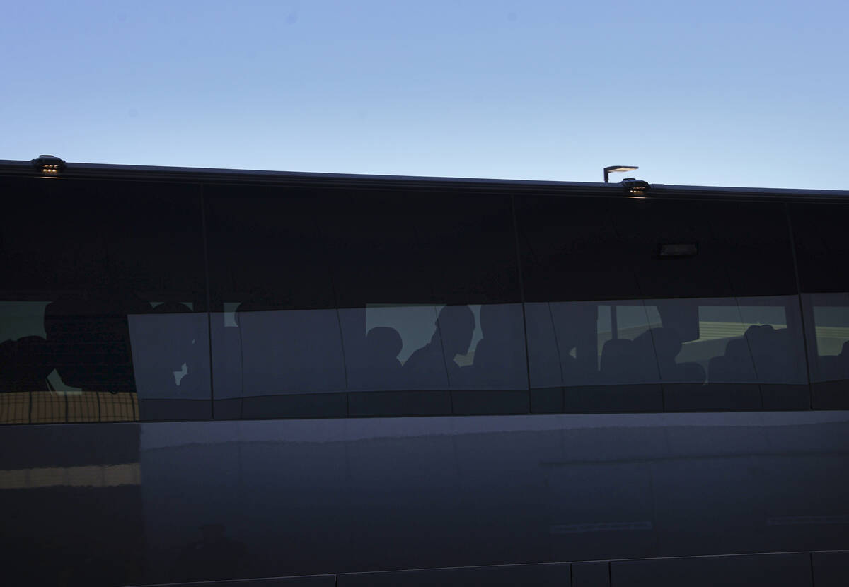 A bus with UNLV football players arrives for practice at the Raiders headquarters and practice ...