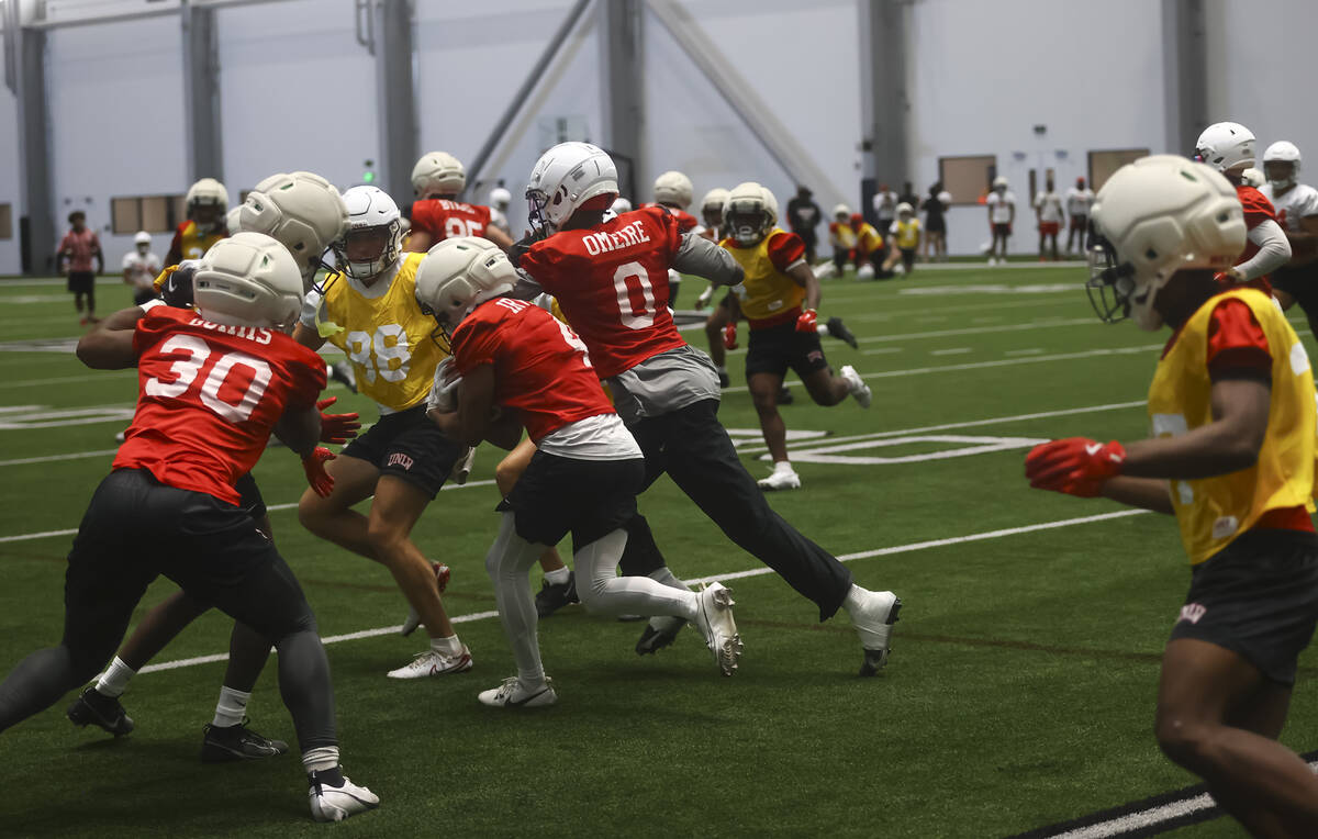 UNLV wide receiver DeAngelo Irvin Jr. (4) carries the ball during football practice at the Raid ...