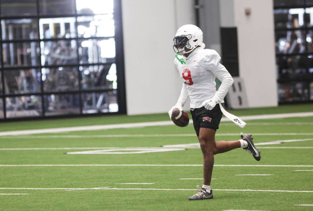 UNLV running back Jai'Den Thomas (9) holds the ball during football practice at the Raiders hea ...