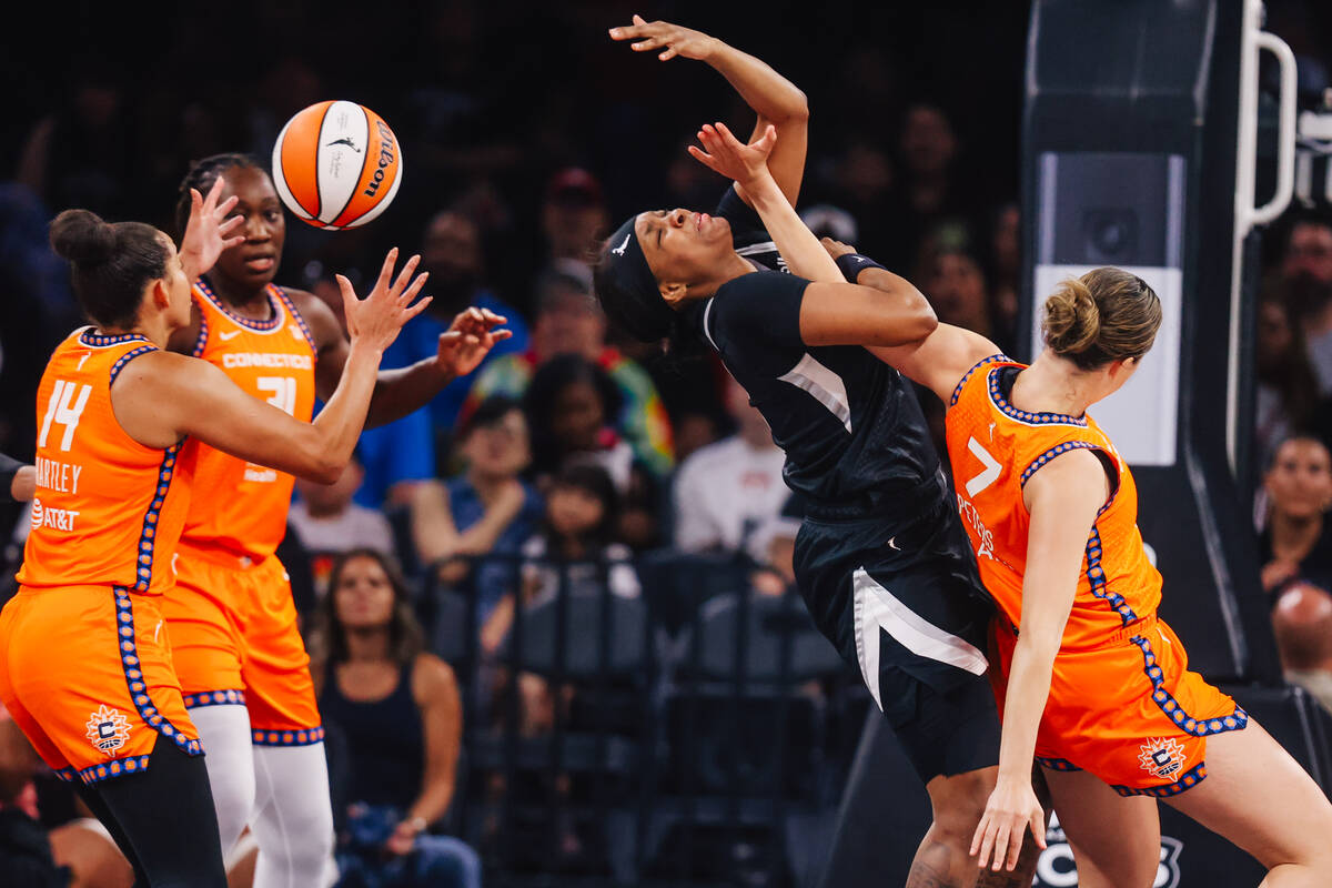 Aces forward NaLyssa Smith (3) loses the ball during a WNBA basketball game between the Aces an ...