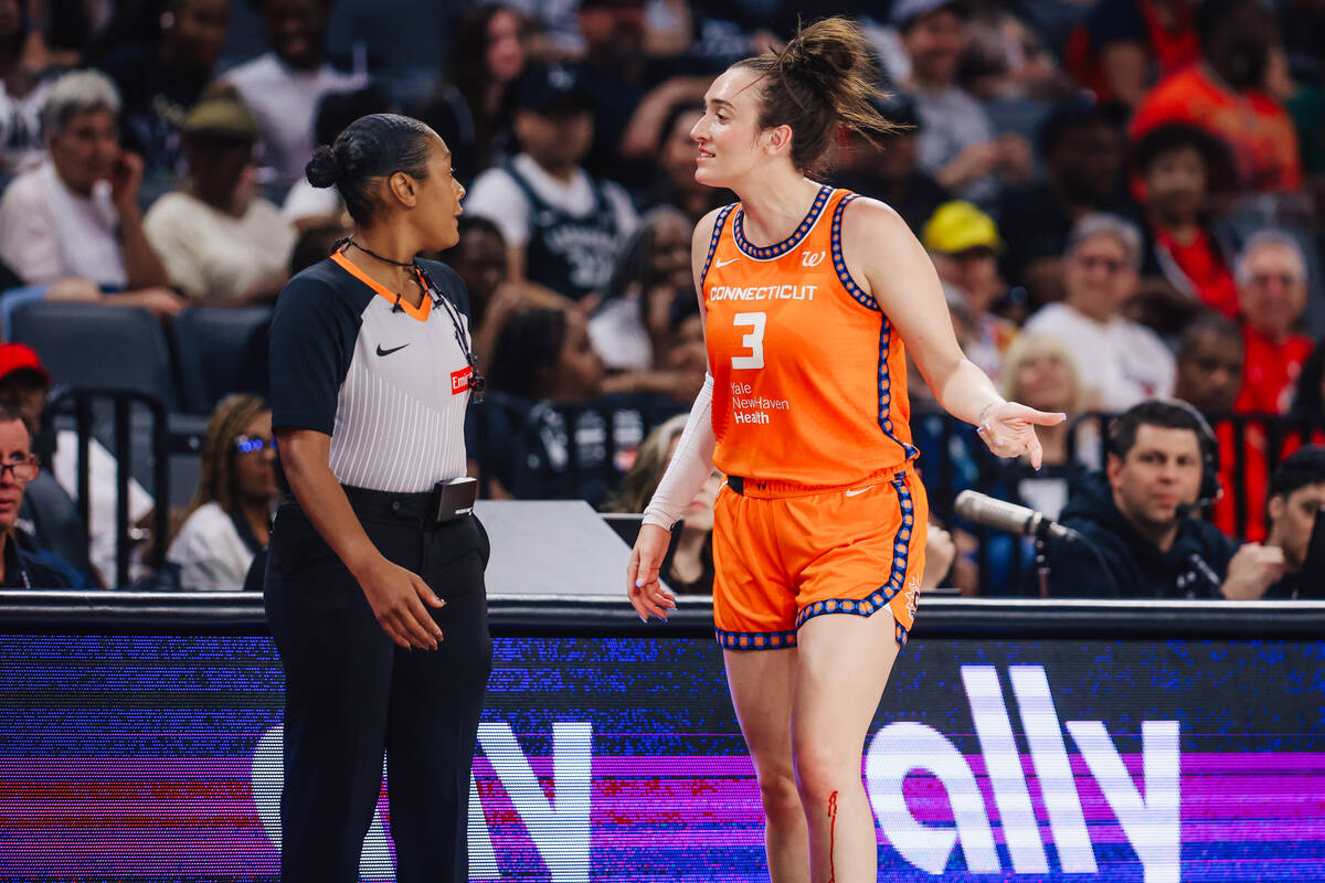 Connecticut Sun guard Marina Mabrey tries to reason with a referee before walking off court to ...