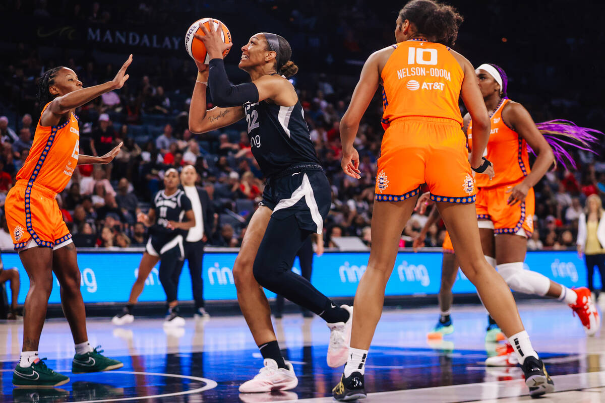 Aces center A'ja Wilson (22) attempts to put up a shot during a WNBA basketball game between th ...
