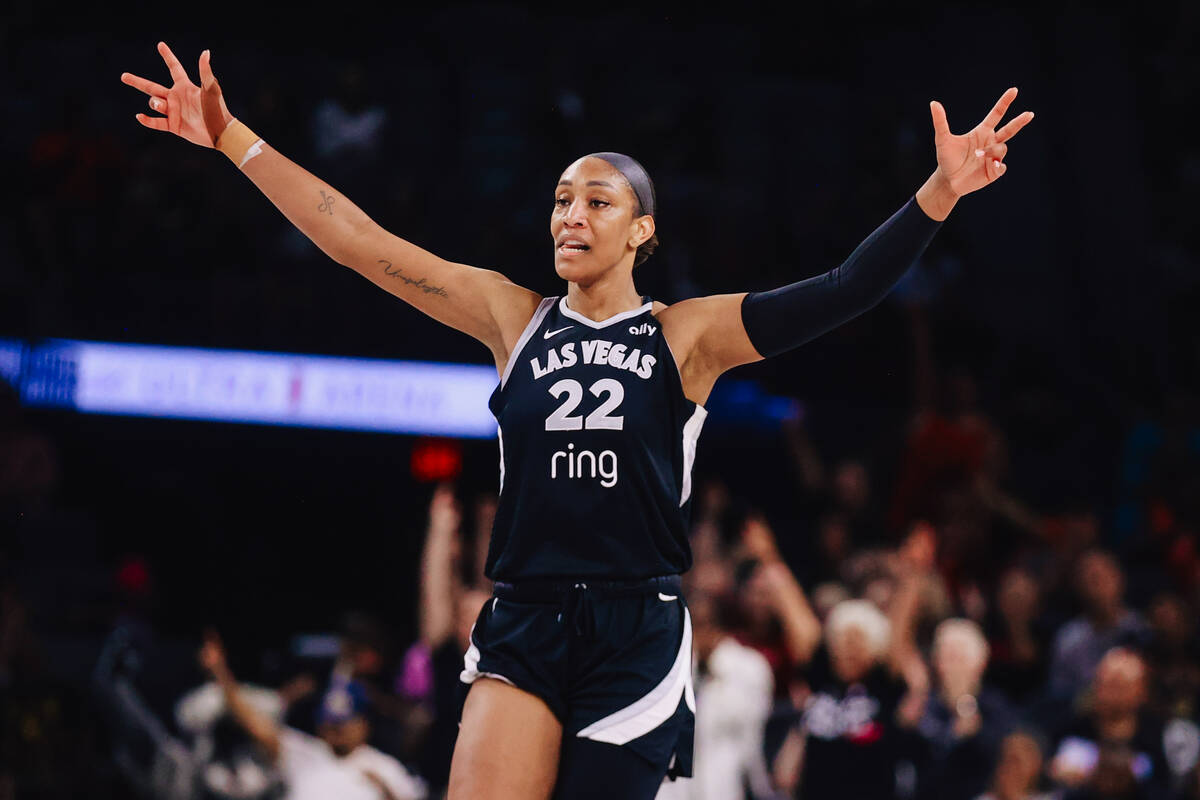 Aces center A'ja Wilson (22) celebrates down the court during a WNBA basketball game between th ...