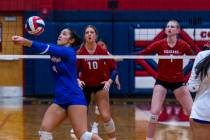 Bishop Gorman's Trinity Thompson (9) digs out a shot as Coronado's Rachel Schwartz (10) and Han ...
