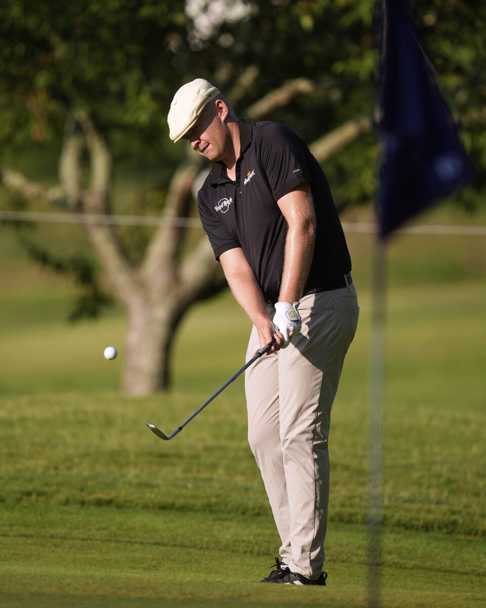 Harry Hall, of England, chips on second hole during the first round of the St. Jude Championshi ...