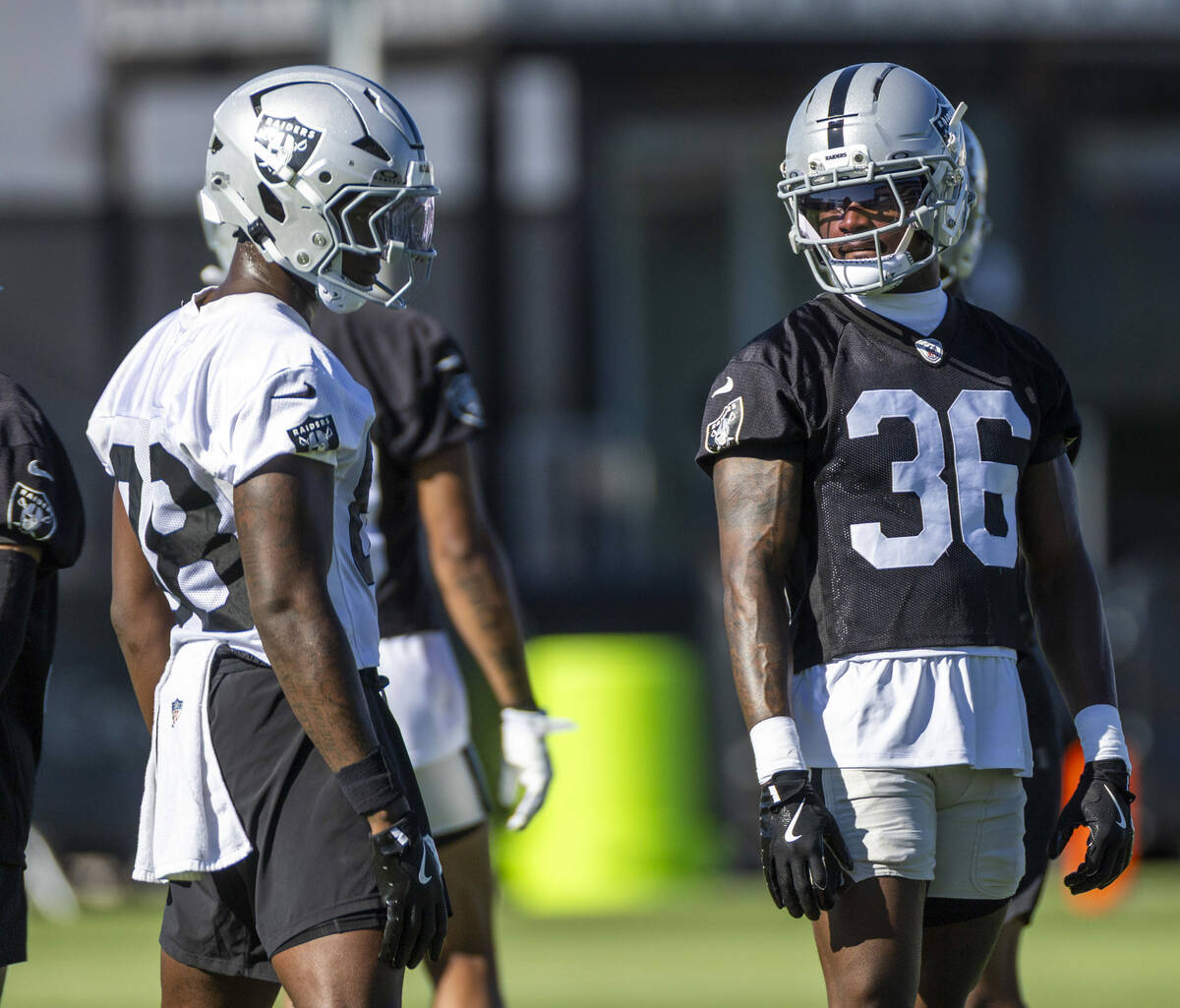 Raiders tight end Justin Shorter (88) and cornerback Kyu Blu Kelly (36) look on during the firs ...