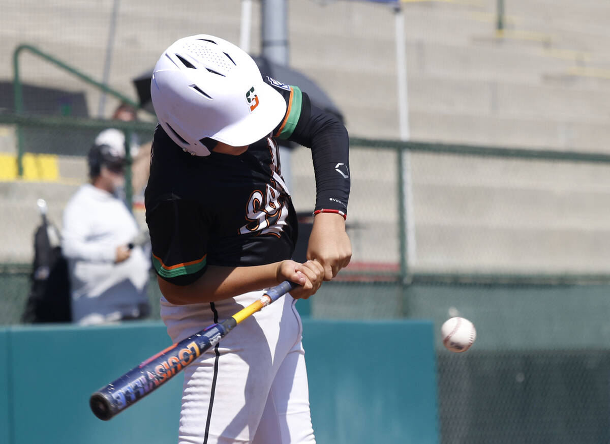 Nevada first baseman Gray Miranda connects against Utah during the Mountain Regional final base ...