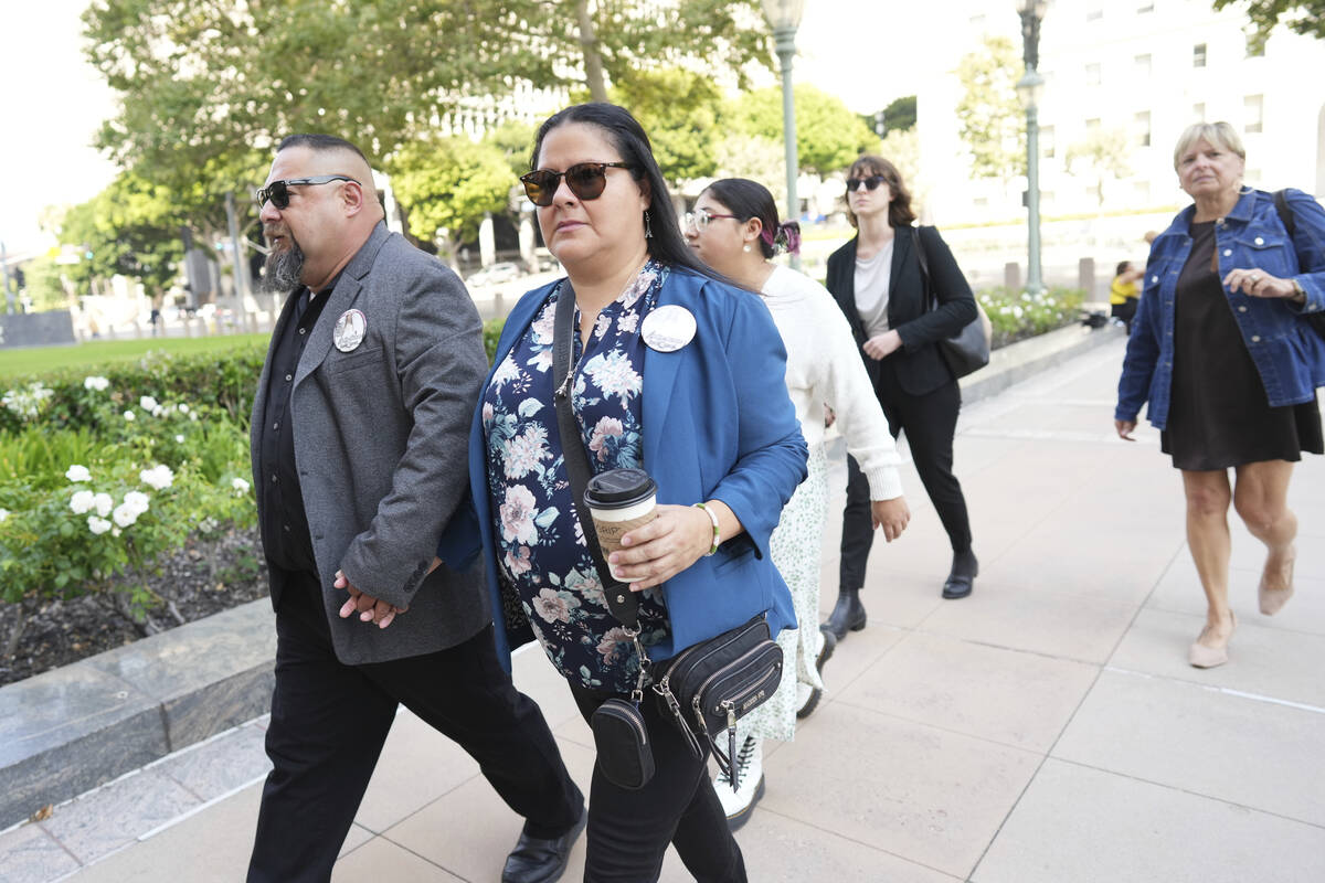 Javier Cazares, left, and Gloria Cazares arrive for a court hearing in a lawsuit between victim ...