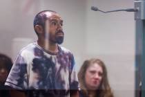 Christian Vega stands before a judge for his initial appearance at the Regional Justice Center ...