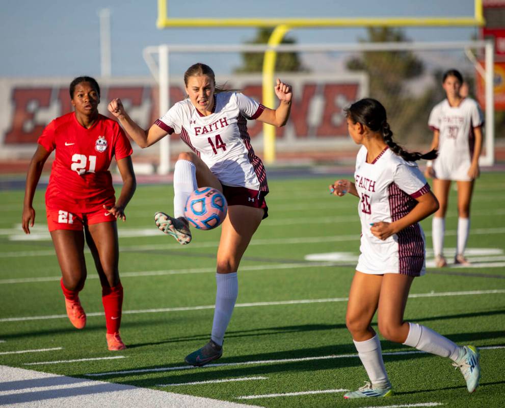 Faith Lutheran defender Kloe Abdalla (14) receives a pass during the high school soccer game ag ...