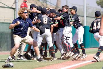 Nevada team head coach TJ Fechser, left, celebrates with his players after winning 6-3 against ...
