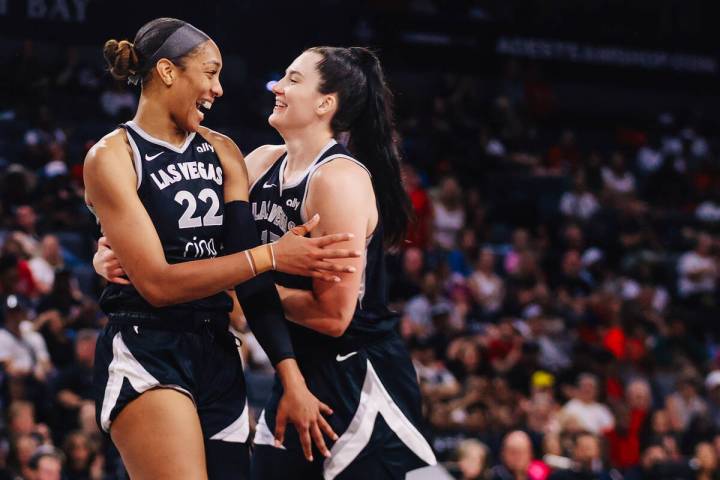 Aces center A'ja Wilson (22) and Aces center Megan Gustafson (17) giggle with each other during ...