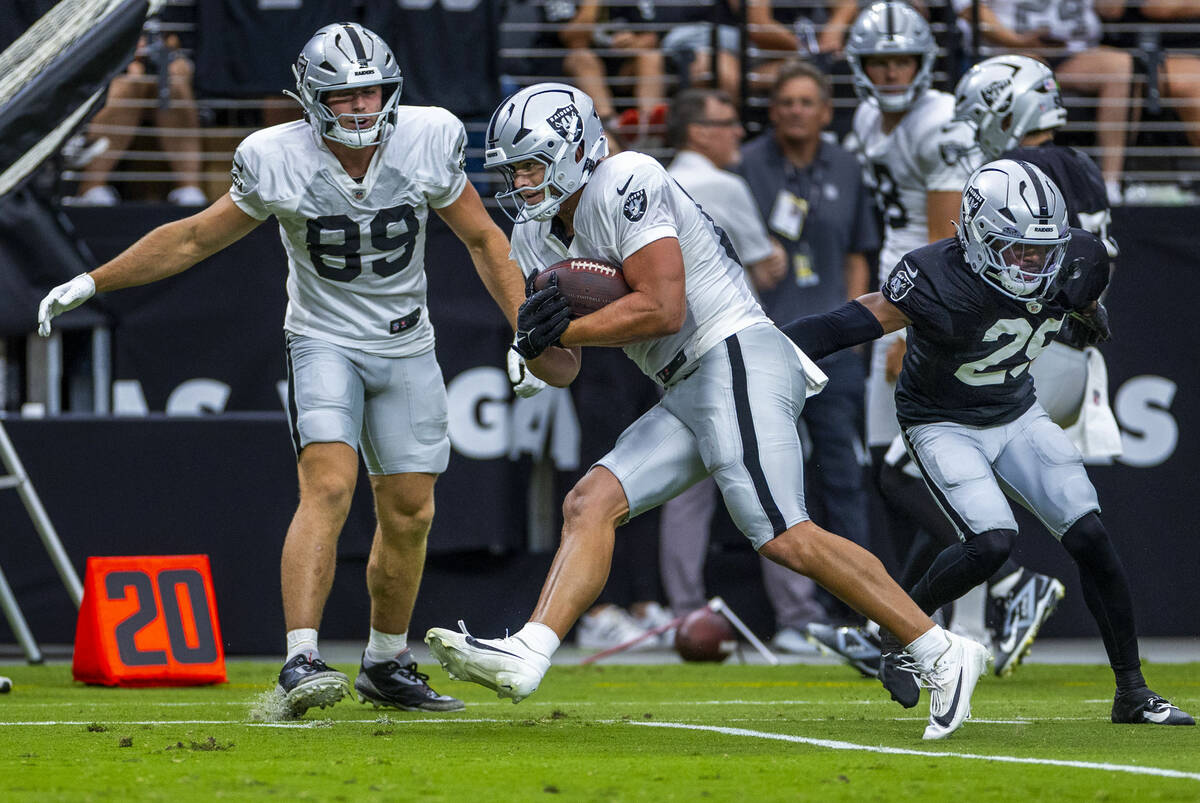 Raiders tight end Michael Mayer (87) looks for room to run after a catch during the first half ...