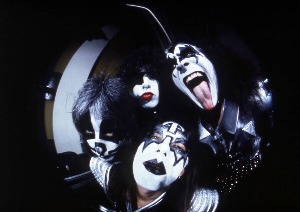 FILE - Members of the rock group KISS; Gene Simmons, clockwise from right, Ace Frehley, Peter C ...