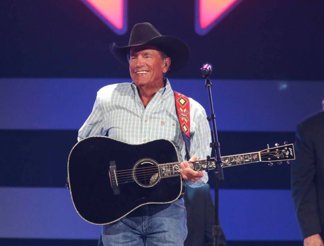 FILE - George Strait performs at the iHeartCountry Festival on Saturday, Oct. 30, 2021, at the ...