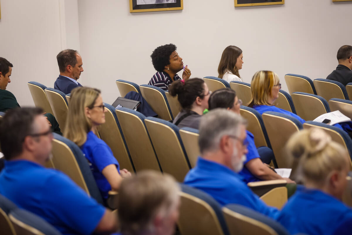 Audience members look on as the Clark County School District Board of Trustees reviews a contra ...