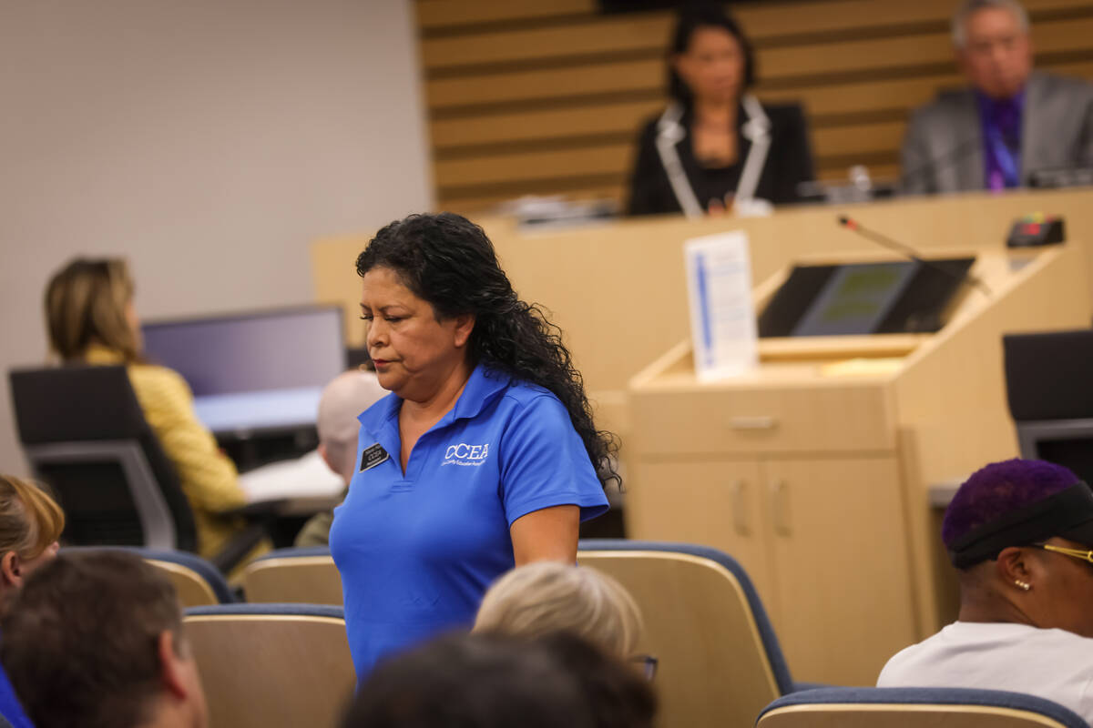 Marie Neisess, president of the Clark County Education Association, returns to her seat after s ...