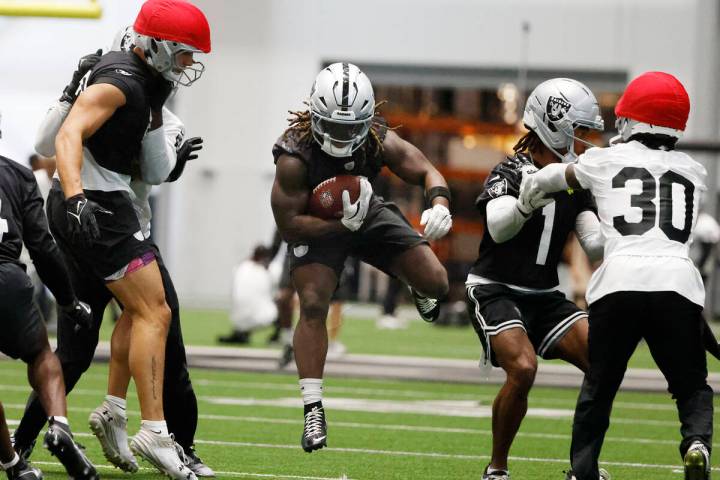 Raiders running back Ashton Jeanty (2) runs with the ball during training camp at the Intermoun ...