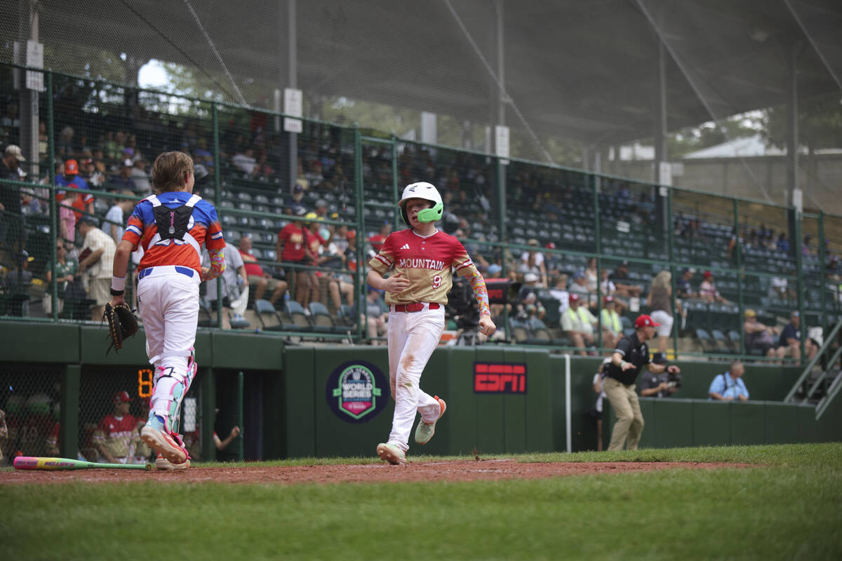 Las Vegas, Nevada's Griffin Vargas crosses home plate against Clarendon Hills, Ill. in the sixt ...