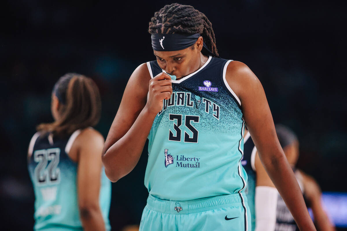 New York Liberty center Jonquel Jones (35) wipes her sweat during a WNBA basketball game betwee ...