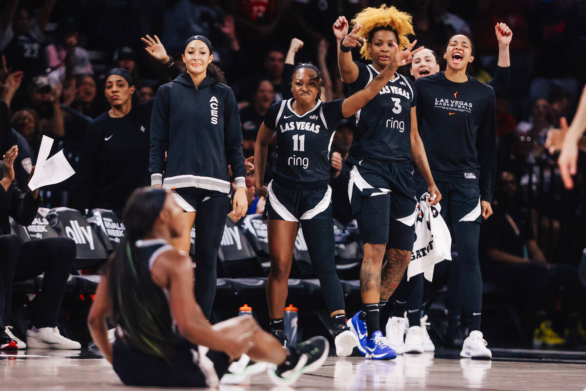 The Aces celebrate Aces guard Jackie Young drawing a foul during a WNBA basketball game between ...