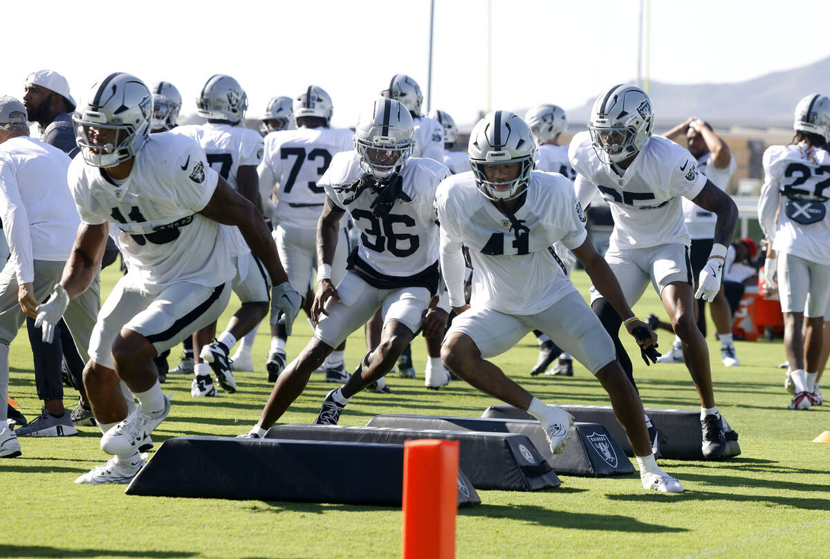 Raiders players go through an agility drill during a joint practice with San Francisco 49ers at ...