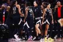 The Aces celebrate during a WNBA basketball game between the Aces and New York Liberty at Miche ...