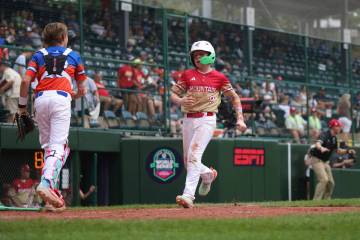 Las Vegas, Nevada's Griffin Vargas crosses home plate against Clarendon Hills, Ill. in the sixt ...