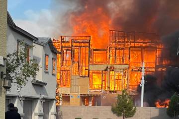 Smoke and flames erupt from a construction site fire in North Las Vegas Tuesday, August 5, 2025 ...