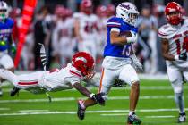 Bishop Gorman wide receiver Aizen Torres (13) heads for the end zone as Arbor View cornerback T ...