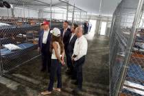 President Donald Trump speaks with reporters as he tours "Alligator Alcatraz," a new ...