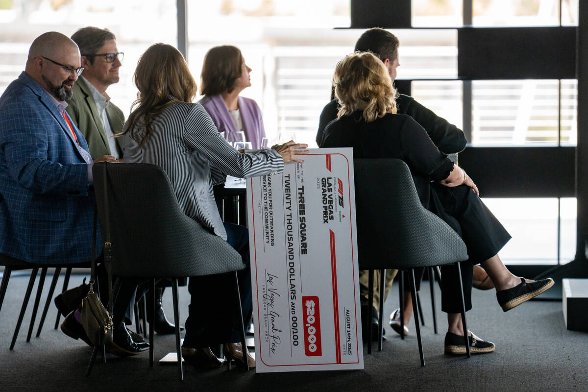 Guests enjoy lunch during a Formula One Las Vegas Grand Prix reception in Las Vegas, Aug. 14, 2 ...