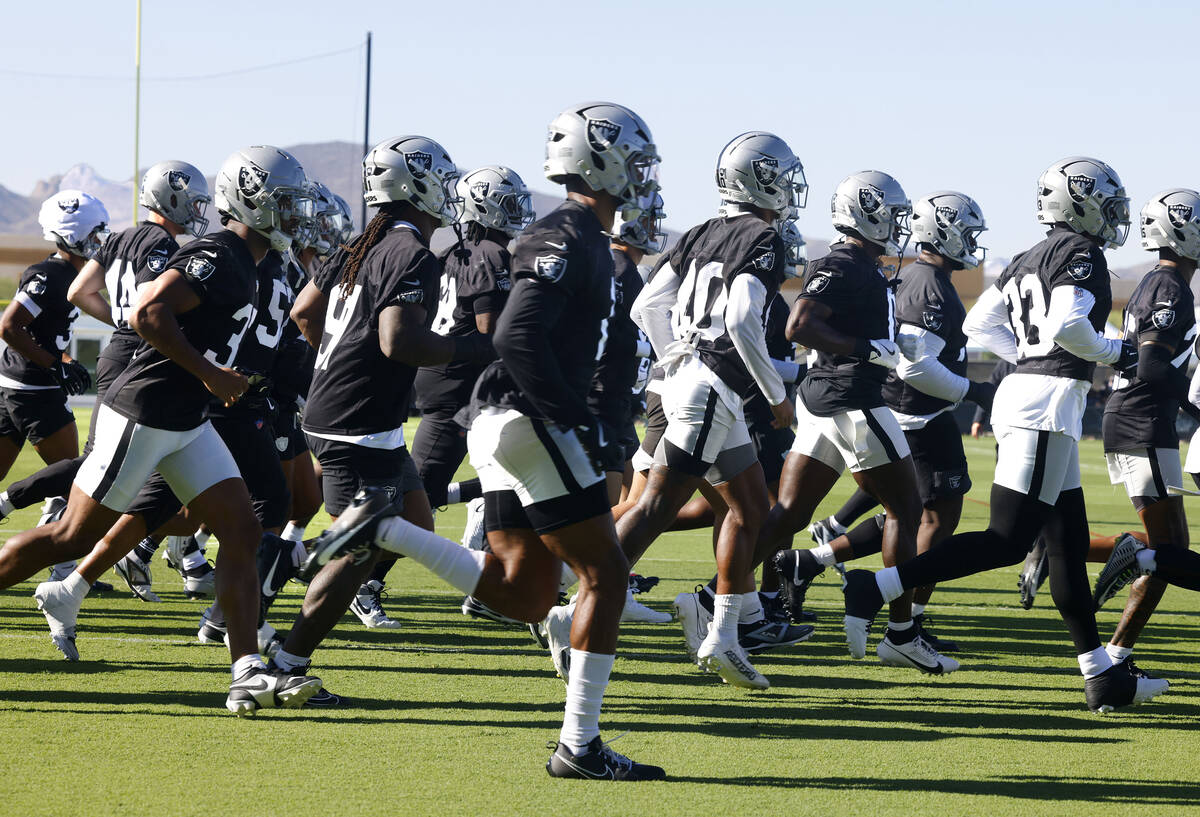 Raiders players take the field during the team’s training camp at the Intermountain Heal ...