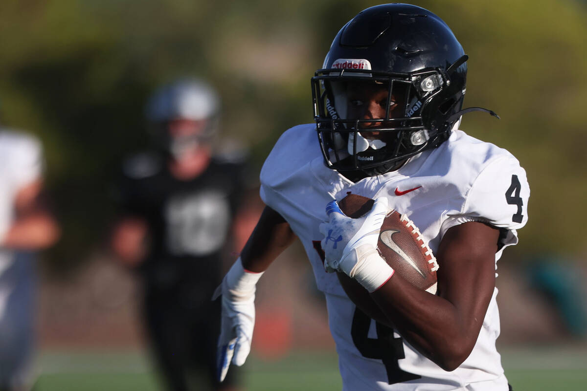 Las Vegas running back Steven Bullock (4) runs for a first half touchdown during a boys 5A high ...
