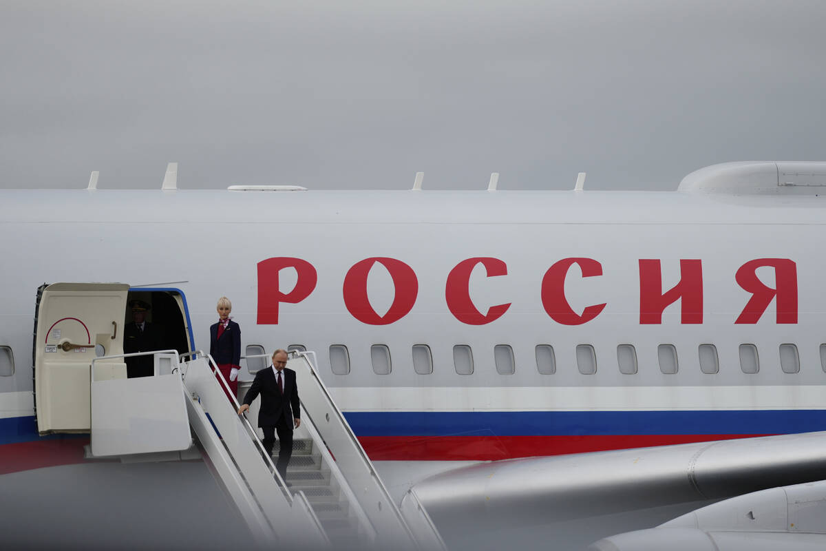Russia's President Vladimir Putin arrives Friday, Aug. 15, 2025, at Joint Base Elmendorf-Richar ...