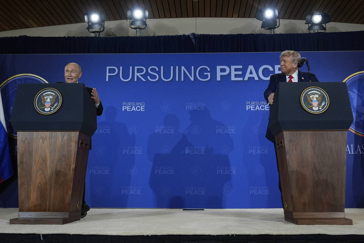 President Donald Trump and Russia's President Vladimir Putin speak during a news conferenc ...