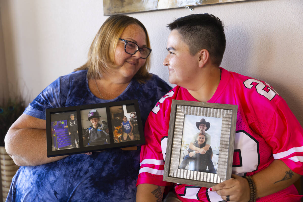 Toni Lee, left, holds a photo of her son, Jacob Lee, alongside her daughter Katelynn Long on Th ...