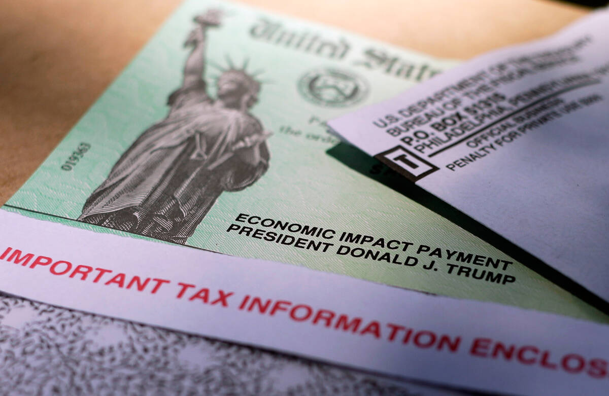 President Donald Trump's name is printed on a stimulus check issued by the IRS to help combat t ...