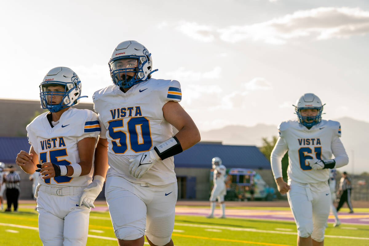 Sierra Vista Mountain Lions leave the field for a water break during their game at Durango High ...
