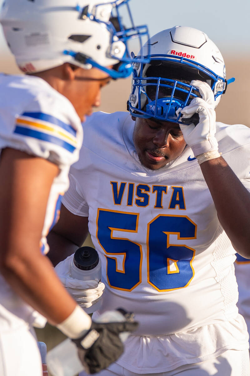 The Sierra Vista Mountain Lions take a water break during their game at Durango High School in ...